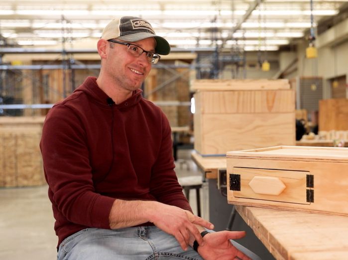 Mike Garrison in the carpentry lab with his box