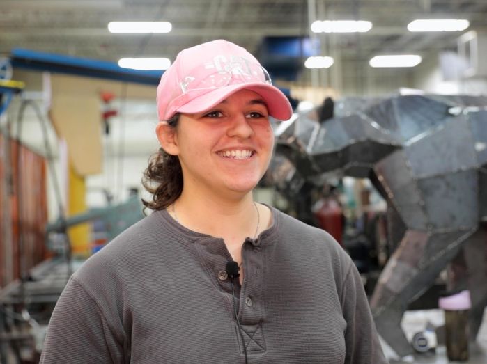Jasslyn smiling in front of panther