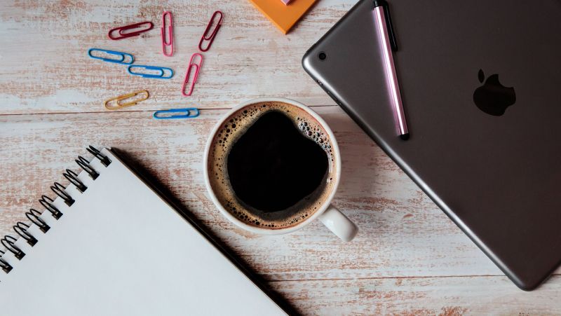 coffee, notepad and laptop