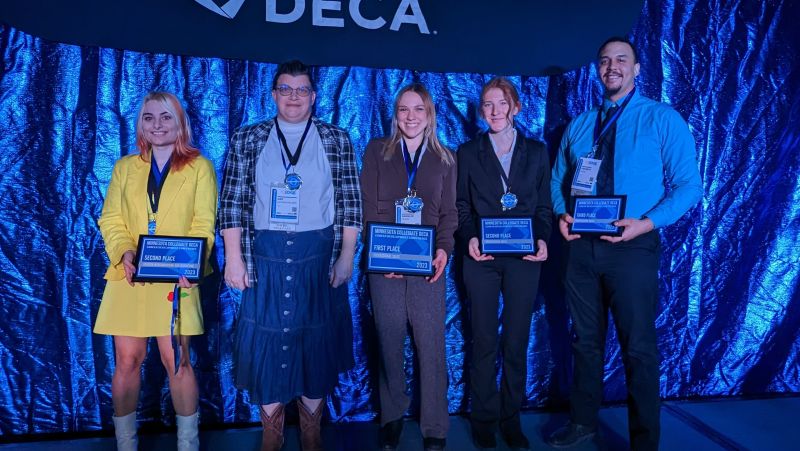 Four students with deca awards
