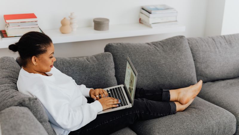 online student on couch