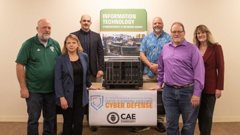 Brian Volkmuth, Jennifer Erickson, Daniel Larson, Ryan Salner, Dave Lerch, Lori Kloos pose with the server