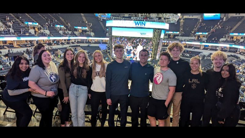 Group of DECA students at the Timerberwolves game