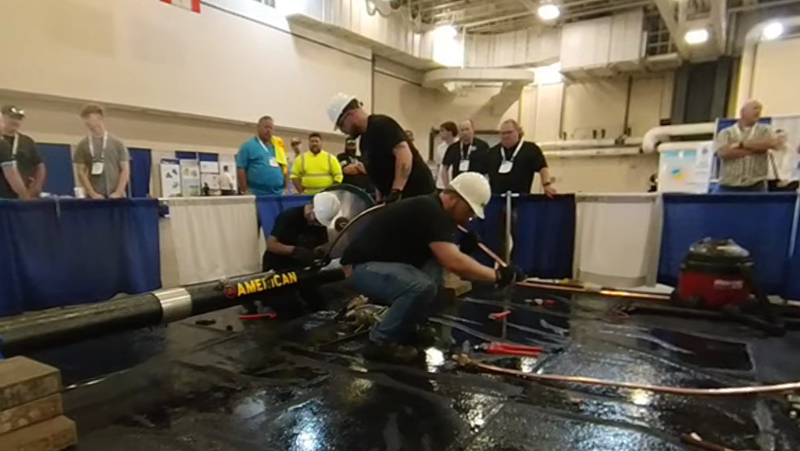 Three SCTCC students at pipe-tapping