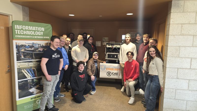 Group of SCTCC cyber students around the mobile lab