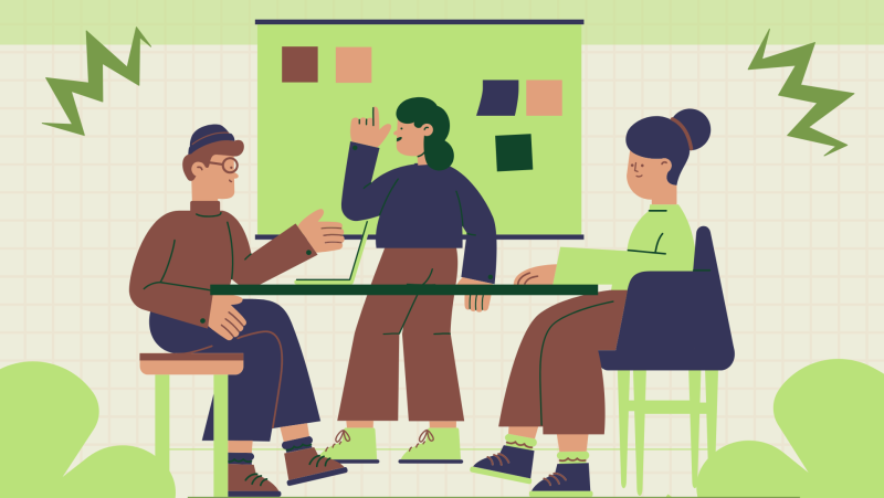 Three people having a meeting at a table with a board and notes