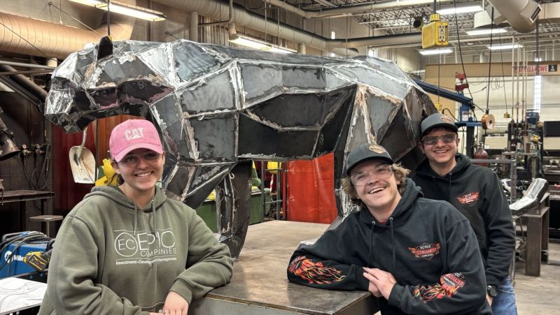 Jasslyn, Logan, and Josh posing in front of the panther before it heads to All Pro