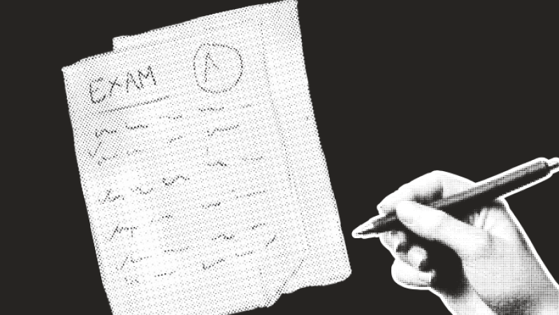 hand holding a pen directed at an exam graded with an "A"