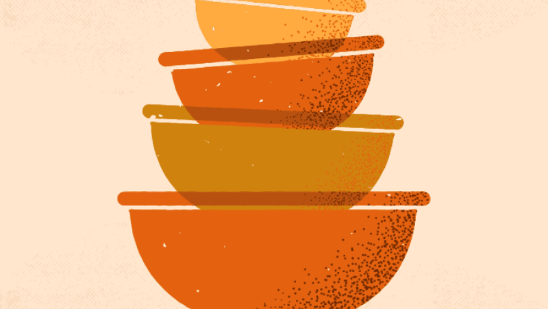 a stack of yellow and orange bowls