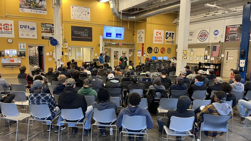 Group of students in chairs watching a presenter