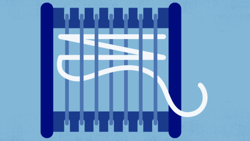 a loom with white yarn 