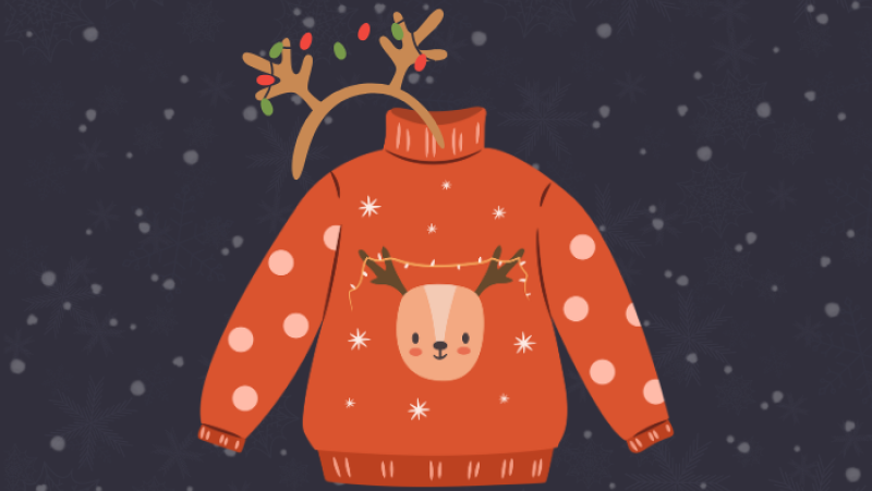 orange sweater with a reindeer on it and a headband with a pair of antlers attached