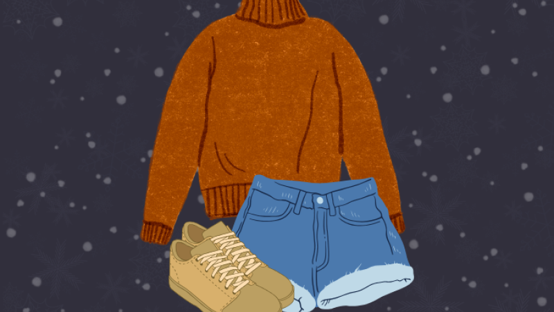 retro orange sweater, distressed blue jean shorts, and a pair of tan sneakers