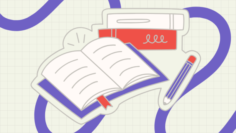 an open book with two books stacked behind it