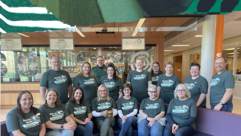 SCTCC staff smiling for group photo for mental health month