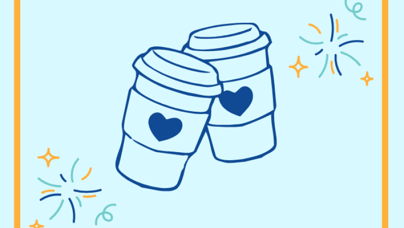 Pair of coffee cups with decorative confetti around them. 