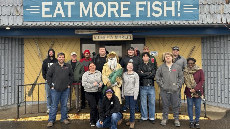 Students and instructors pose outside the Morey's plant