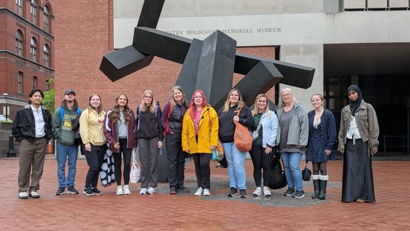 Kathy and students outside museum