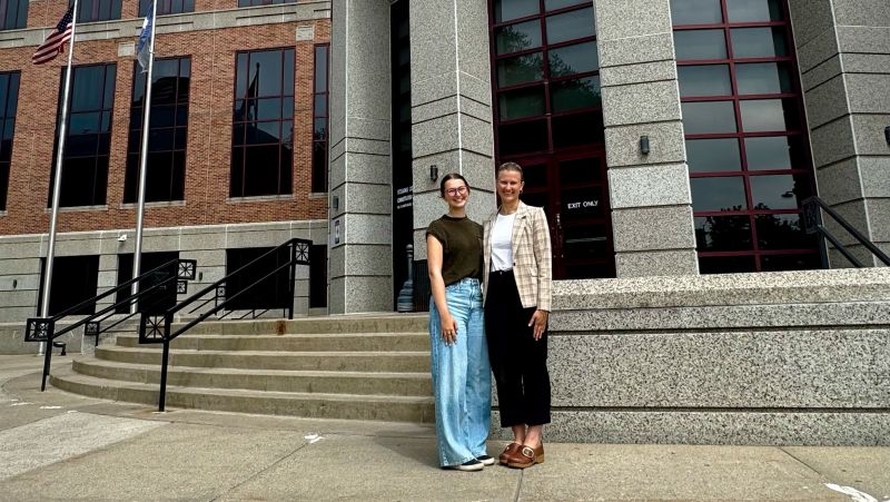 Ava and Emma on the steps of the Stearns County building