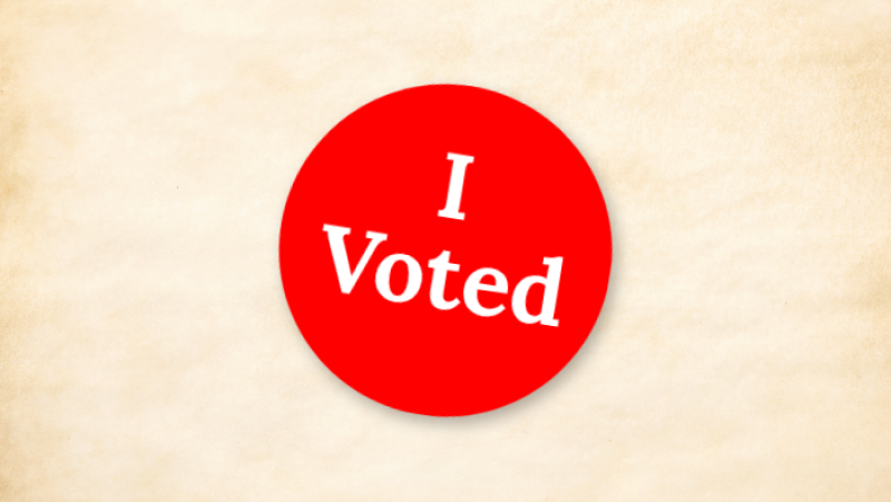 red I voted sticker on old paper background