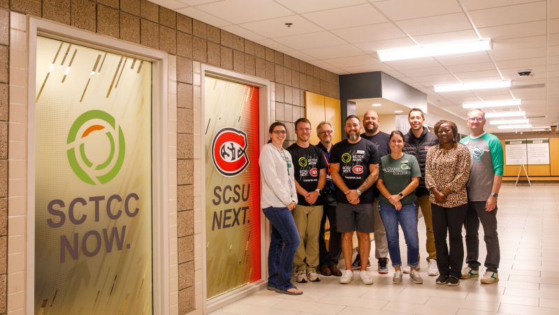 group of SCTCC and SCSU folks in front of husky hub