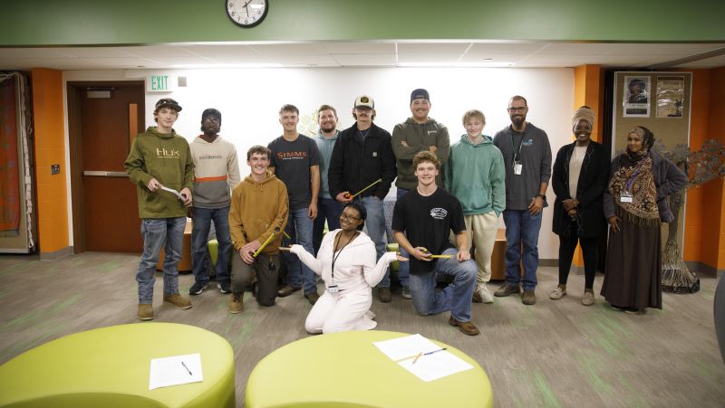 group of electrical students and MCC staff posing for camera