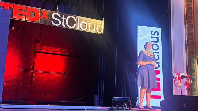 Njeri on stage during her TedX presentation