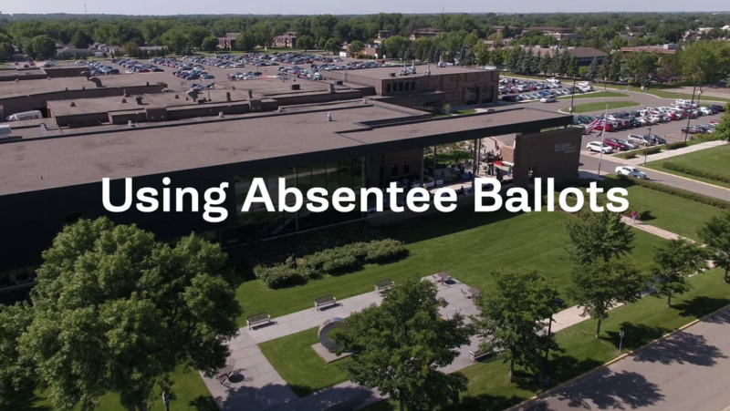 Using absentee Ballots. overhead view of door 1 entrance in background