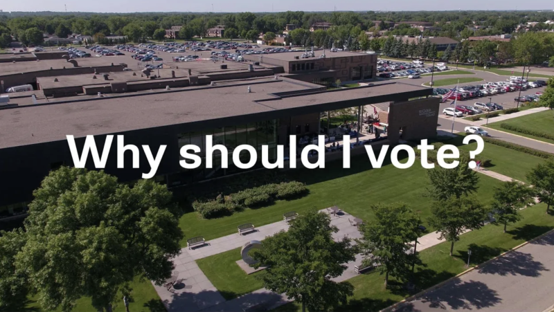 Why Should I vote? overhead view of door 1 entrance in background