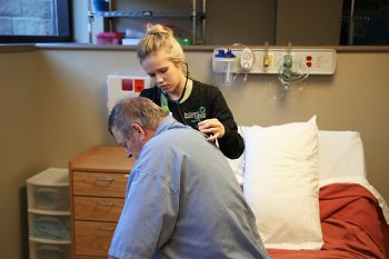 student assessing volunteer patient