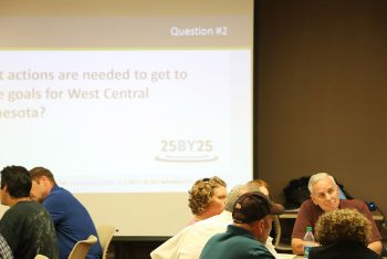 Dayton sitting at town hall table