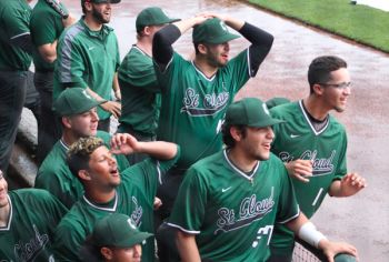 baseball players in dugout cheering