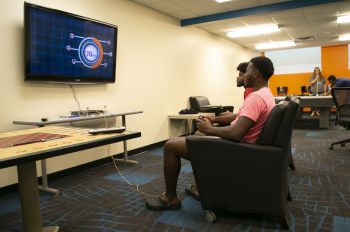 Students playing games in lounge