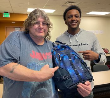 two students with bookbag
