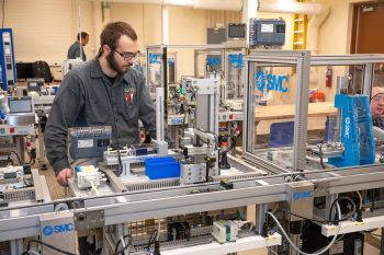 Student focusing on the machinery at hand.