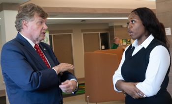 Chancellor olson and kya casseus chatting after the session