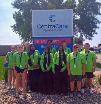 CareerOne students in front of CentraCare sign