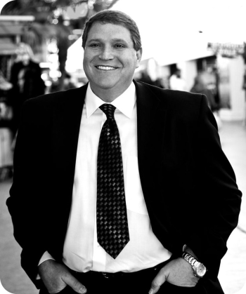 black and white photo of david in a suit