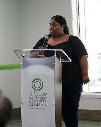 Danika speaking at a podium