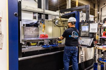Millebrandt employee working on CNC maching