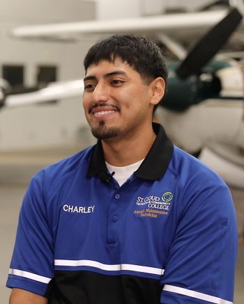 Charley Vivar sitting in the AMT lab