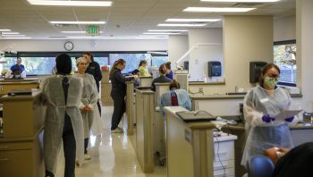 students in the dental clinic waiting for patients