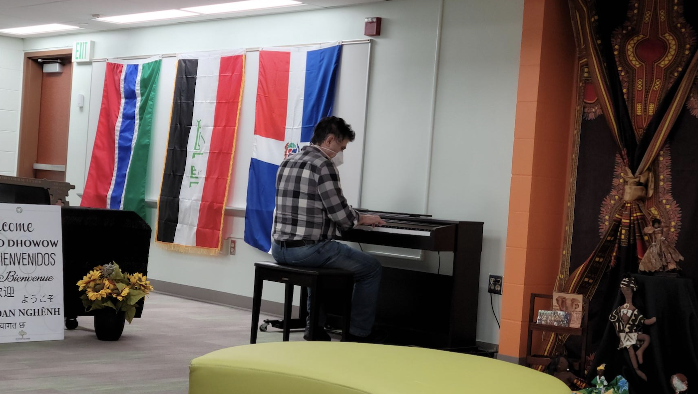 man playing piano in MCC