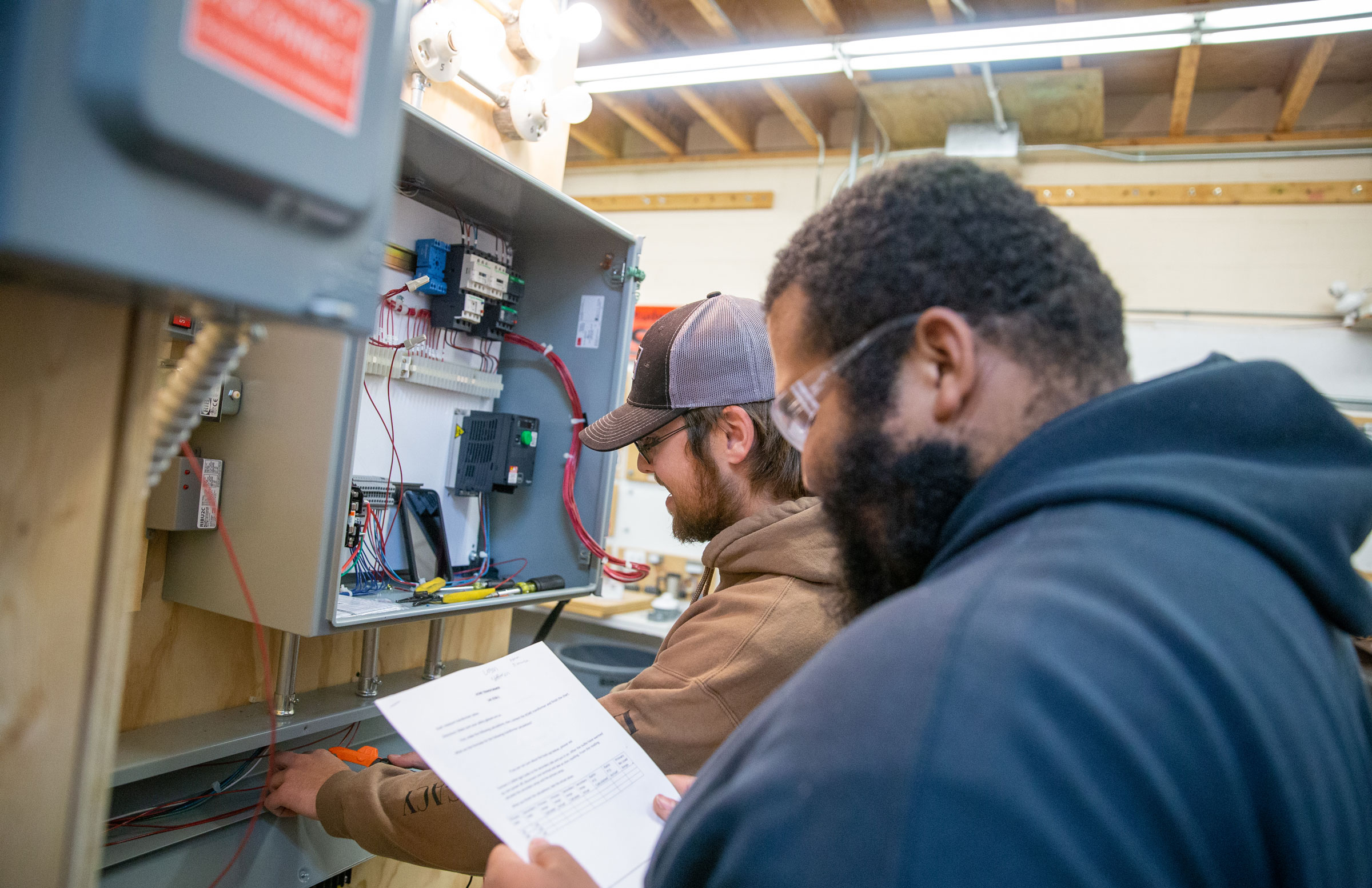 Electrical students working with wires