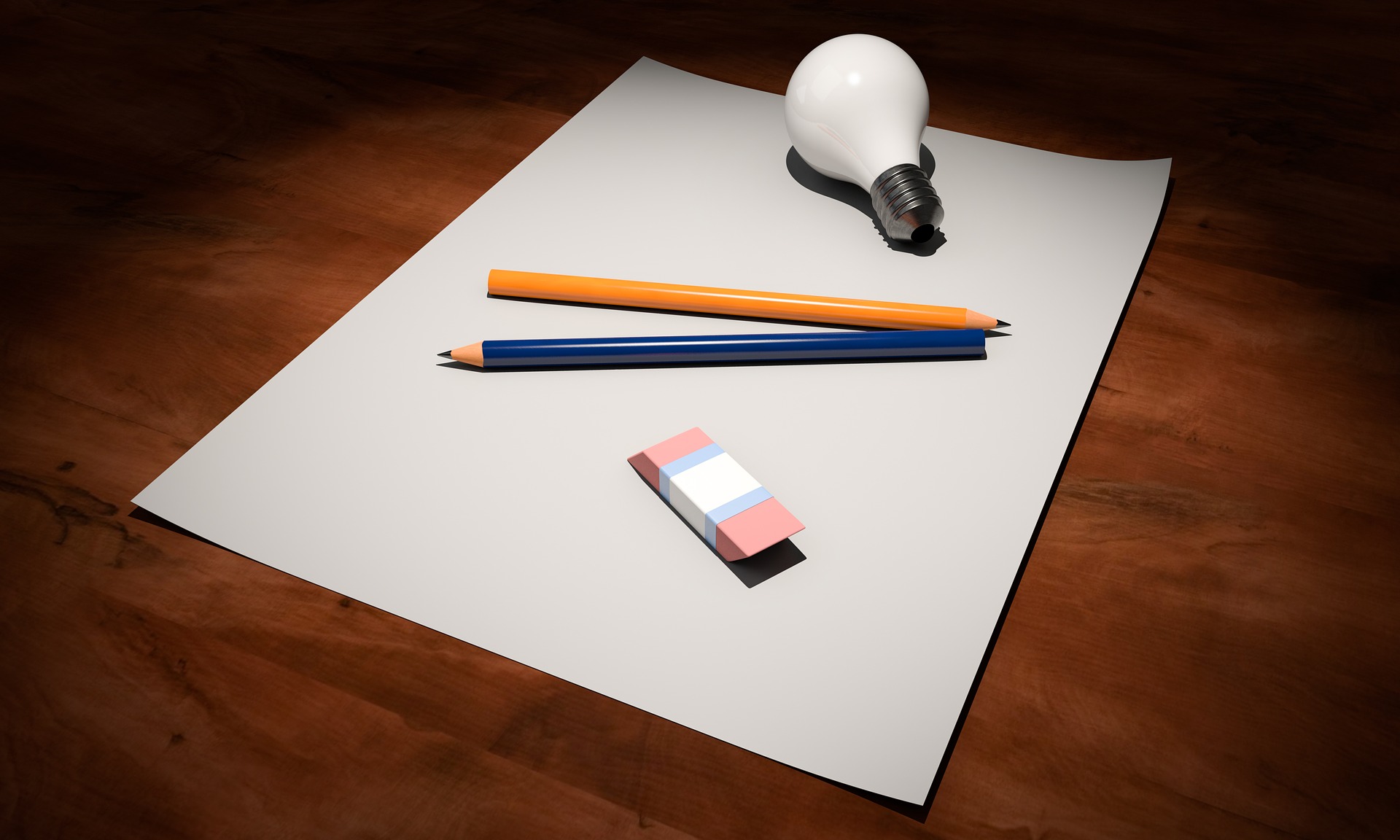 pencil eraser light bulb and blank paper