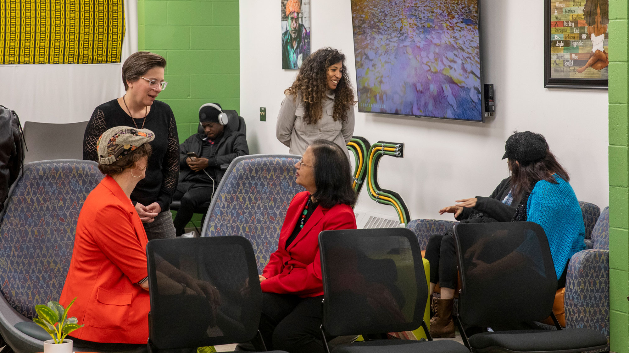 Crowd of people in the multicultural center chatting