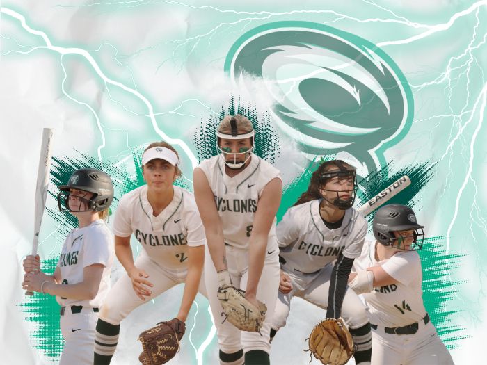 Softball players with Cyclones logo