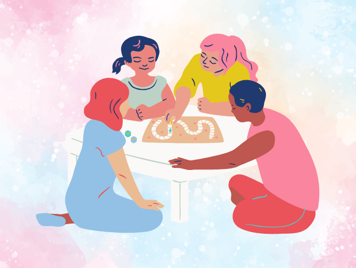 four people playing a board game