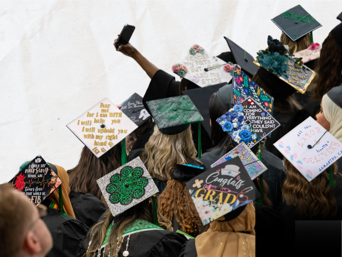 a group of graduates, all with decorated caps!