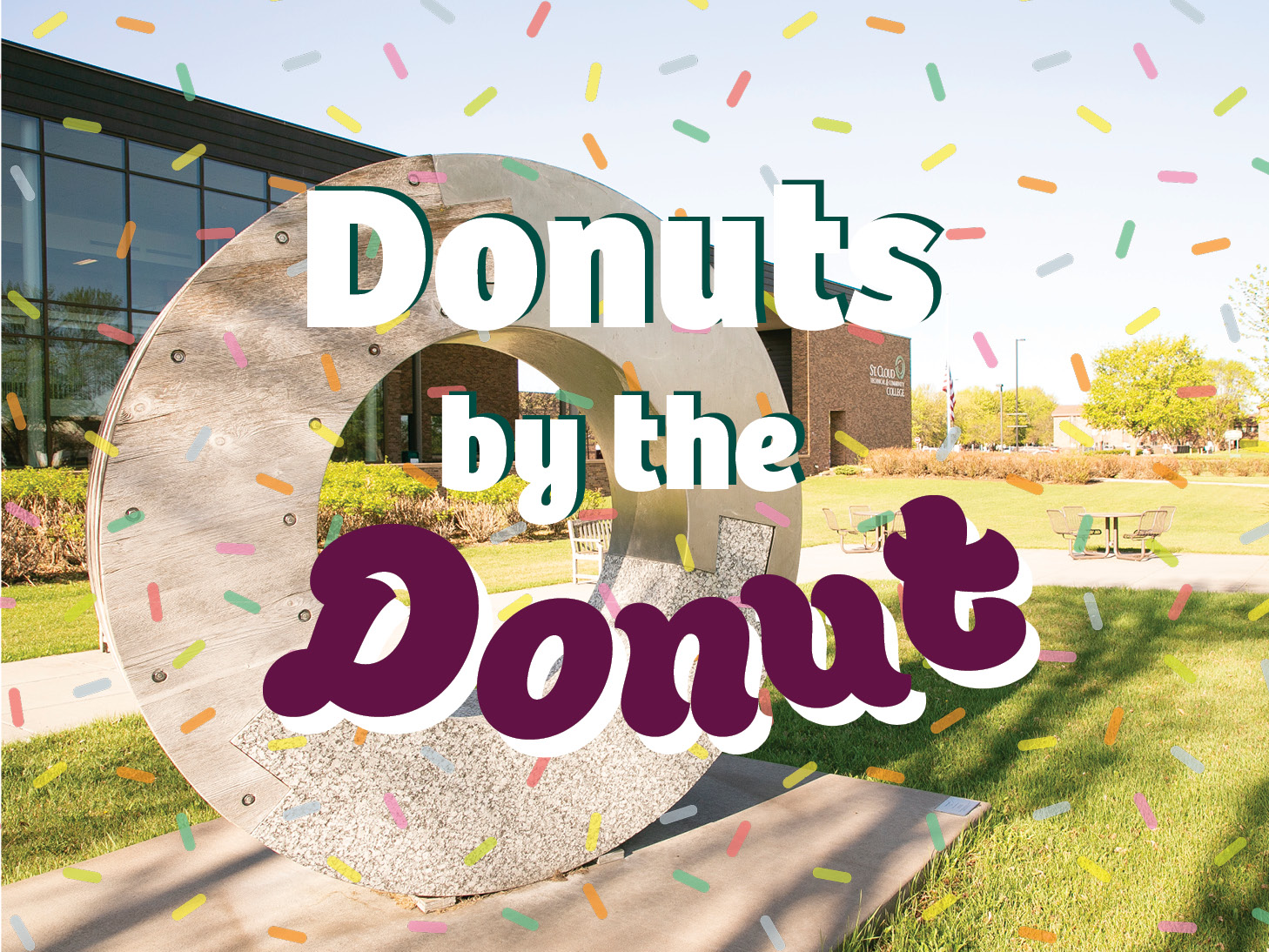 Donuts by the Donut written over Emblem of Unity outside main entrance with sprinkles